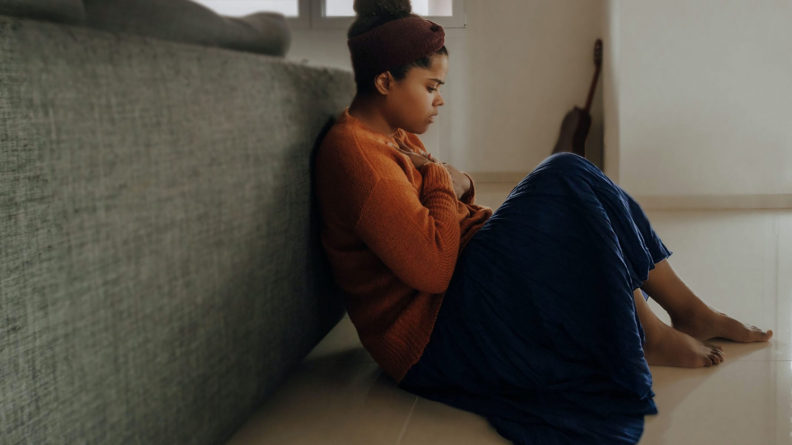 "Anxious woman sitting by a coach"